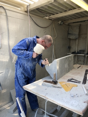 Preparing the new ragstone in the workshop