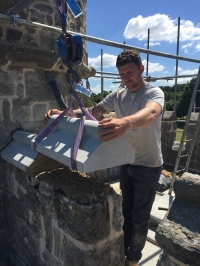 Lowering the new block into place